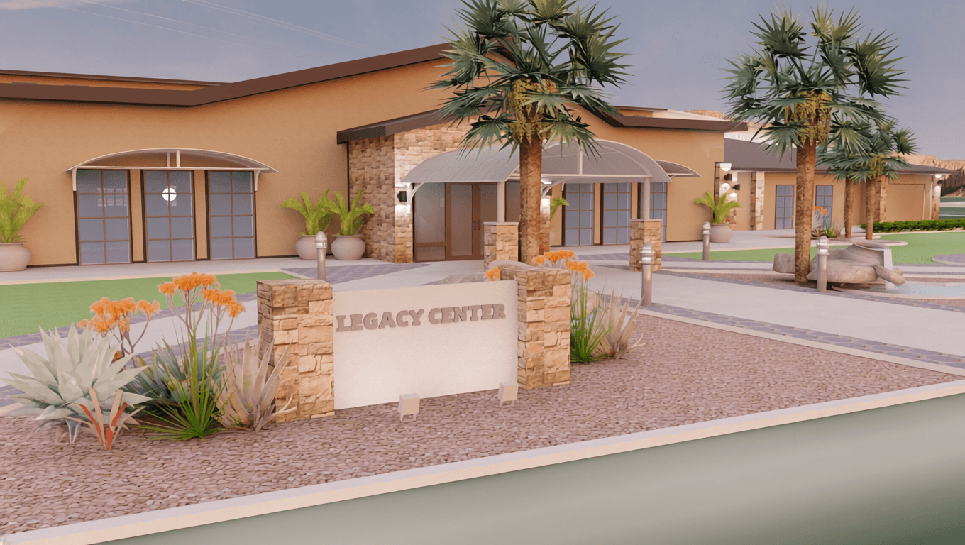 The Legacy Center monument sign with the building behind it
